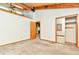 Lofted bedroom showcasing a beamed ceiling, closet, carpet floors, and natural light at 13581 Sable Blvd, Brighton, CO 80601