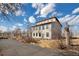 Unique two-story home featuring large windows and a modern roofline, set on a spacious lot at 13581 Sable Blvd, Brighton, CO 80601