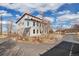 Two-story home showcasing large windows and modern design elements on a spacious lot at 13581 Sable Blvd, Brighton, CO 80601