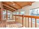 Bright hallway featuring wood floors and railings under a wood beamed ceiling at 13581 Sable Blvd, Brighton, CO 80601