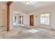 Spacious living room with neutral carpet, built-in shelving, and ample natural light at 13581 Sable Blvd, Brighton, CO 80601