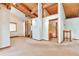 Living room with high, vaulted, wood ceilings and trim, and neutral carpet at 13581 Sable Blvd, Brighton, CO 80601