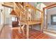 Indoor staircase with wood railings and tile flooring at 13581 Sable Blvd, Brighton, CO 80601