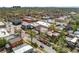 Aerial view of neighborhood featuring street with parked cars and commercial and residential properties at 34 W Maple Ave, Denver, CO 80223