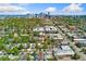 Aerial view showing a downtown cityscape in the distance behind residential housing near the home at 34 W Maple Ave, Denver, CO 80223