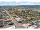 View of a vibrant city neighborhood, showcasing a mix of buildings, streets, and distant mountain views at 34 W Maple Ave, Denver, CO 80223