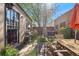 Secluded backyard offering patio space, mature trees, outdoor seating, and a grill for outdoor cooking at 34 W Maple Ave, Denver, CO 80223