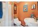 Functional bathroom featuring a stand-up shower, modern toilet, and stylish sink at 34 W Maple Ave, Denver, CO 80223