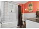 Bathroom featuring a shower and tub combo with a modern vanity at 34 W Maple Ave, Denver, CO 80223