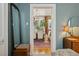 View of dining room with hardwood floors through doorway with blue walls at 34 W Maple Ave, Denver, CO 80223