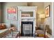 Elegant living room fireplace with decorative mantle, marble surround, and stylish decor for a cozy atmosphere at 34 W Maple Ave, Denver, CO 80223
