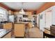 Charming kitchen with stainless steel appliances, center island, and bar stools at 34 W Maple Ave, Denver, CO 80223