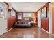 Cozy living room featuring hardwood floors, comfortable seating, natural light, and tasteful decor at 34 W Maple Ave, Denver, CO 80223