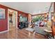 Inviting living room features hardwood floors, entertainment center, and comfortable seating area with natural light at 34 W Maple Ave, Denver, CO 80223
