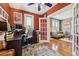 Office space featuring hardwood floors, ample natural light, with open access to the living room at 34 W Maple Ave, Denver, CO 80223