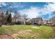 Expansive backyard featuring a lush lawn, mature trees, and ample space for outdoor activities at 2754 S Sherman St, Englewood, CO 80113
