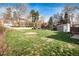 Large grassy backyard perfect for recreation, showcasing lush grass and surrounding privacy fence at 2754 S Sherman St, Englewood, CO 80113