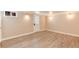 Spacious basement area featuring neutral paint, ample lighting and clean plank flooring at 2754 S Sherman St, Englewood, CO 80113
