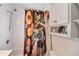 Bathroom featuring a colorful owl shower curtain and tile walls at 2754 S Sherman St, Englewood, CO 80113