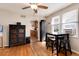Cozy dining area with hardwood floors, a table, and a view into the well-equipped kitchen at 2754 S Sherman St, Englewood, CO 80113