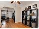 Dining room with hardwood floors, storage furniture, and an open layout connecting to the living room at 2754 S Sherman St, Englewood, CO 80113
