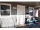 Inviting covered front porch with seating area, perfect for relaxing and enjoying the neighborhood views at 2754 S Sherman St, Englewood, CO 80113