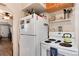 A classic kitchen features a white fridge and electric stove top at 2754 S Sherman St, Englewood, CO 80113