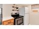 Kitchen showcasing modern stainless steel appliances and white refrigerator at 2754 S Sherman St, Englewood, CO 80113