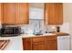 A bright kitchen features oak cabinets and a white tile backsplash at 2754 S Sherman St, Englewood, CO 80113