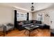Well-lit living room with hardwood floors, a comfortable sofa, and decorative accents, creating a welcoming atmosphere at 2754 S Sherman St, Englewood, CO 80113