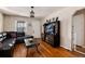 Cozy living room with hardwood floors, ample natural light, and a stylish entertainment center at 2754 S Sherman St, Englewood, CO 80113