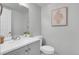Clean bathroom features modern vanity with stylish fixtures and white walls at 1344 Sable Blvd, Aurora, CO 80011