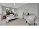 Cozy bedroom with a large window, soft carpet, and neutral decor at 1344 Sable Blvd, Aurora, CO 80011