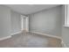 Empty bedroom features neutral paint, plush carpet, and easy access to other rooms at 1344 Sable Blvd, Aurora, CO 80011