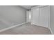 View of a bedroom featuring neutral paint, carpet, and a closet for ample storage space at 1344 Sable Blvd, Aurora, CO 80011