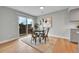 Cozy dining area featuring hardwood floors and a sliding glass door at 1344 Sable Blvd, Aurora, CO 80011