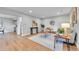 Bright living room features hardwood floors, recessed lighting, and stylish modern furniture at 1344 Sable Blvd, Aurora, CO 80011