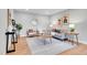 Comfortable living room with modern decor and furnishings on hardwood floor at 1344 Sable Blvd, Aurora, CO 80011