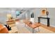 Bright living room with hardwood floors, modern decor, and easy access to the backyard at 1344 Sable Blvd, Aurora, CO 80011