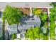 An aerial view of a home and landscaped grounds showcasing beautiful gardens and hardscapes at 6901 E 12Th Ave, Denver, CO 80220