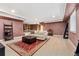 Finished basement featuring a comfortable sitting area, and stairs to upper levels at 6901 E 12Th Ave, Denver, CO 80220