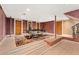 Finished basement features a ping pong table, and multiple access doors at 6901 E 12Th Ave, Denver, CO 80220