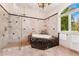Luxurious bathroom featuring marble shower, soaking tub, and swan adornment at 6901 E 12Th Ave, Denver, CO 80220
