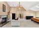 Spacious bedroom with a fireplace, a vaulted ceiling, and a neutral color palette at 6901 E 12Th Ave, Denver, CO 80220