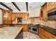 Custom kitchen with a large island, granite countertops, and premium appliances at 6901 E 12Th Ave, Denver, CO 80220