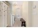 Bright laundry room with modern appliances, built-in storage, and access to a convenient 'toilette' at 6901 E 12Th Ave, Denver, CO 80220