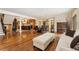 Open floor plan with hardwood floors connecting the dining area and kitchen at 6901 E 12Th Ave, Denver, CO 80220