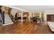 Spacious living area with hardwood floors adjacent to the kitchen and dining area at 6901 E 12Th Ave, Denver, CO 80220