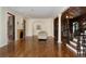 Open-concept living space with hardwood floors, a fireplace, and seamless transitions to other refined living areas at 6901 E 12Th Ave, Denver, CO 80220