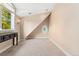 Cozy room featuring neutral carpeting, a large window, and custom decorations at 6901 E 12Th Ave, Denver, CO 80220